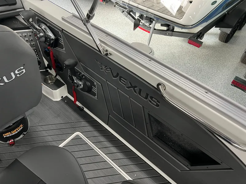 Slide: The Image of 2024 Vexus DVX 20S boat interior with branded seating and control panel. - 15