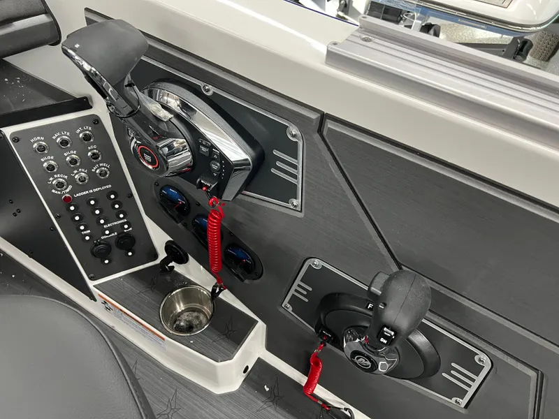 Slide: The Image of 2024 Vexus DVX 20S boat control panel with throttle and switches. - 18