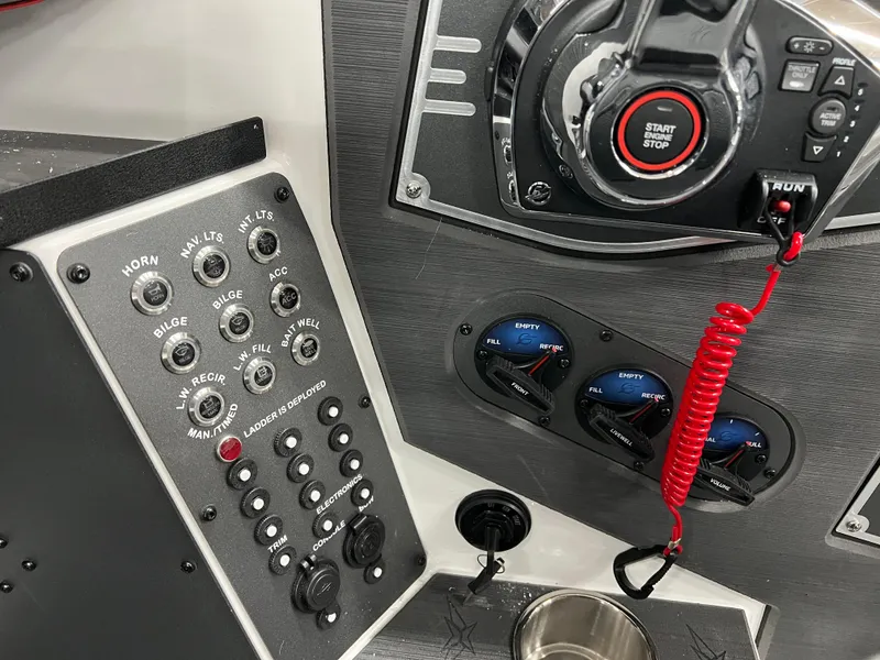Slide: The Image of 2024 Vexus DVX 20S boat control panel with start/stop button and various switches. - 22
