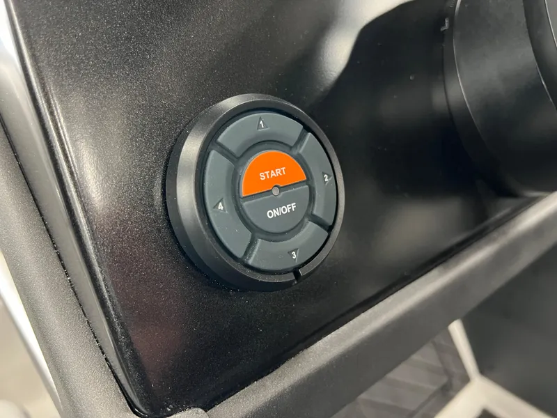 Slide: The Image of 2024 Vexus DVX 20S boat dashboard with start button. - 25