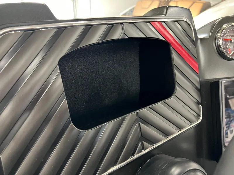 Slide: The Image of 2024 Vexus DVX 20S dashboard with a black and red design. - 26