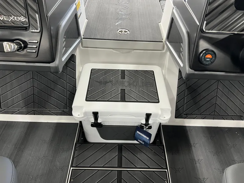 Slide: The Image of 2024 Vexus DVX 20S boat interior with cooler and black flooring. - 27