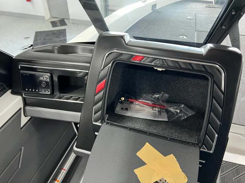 Slide: The Image of 2024 Vexus DVX 20S boat dashboard with open glove compartment. - 29