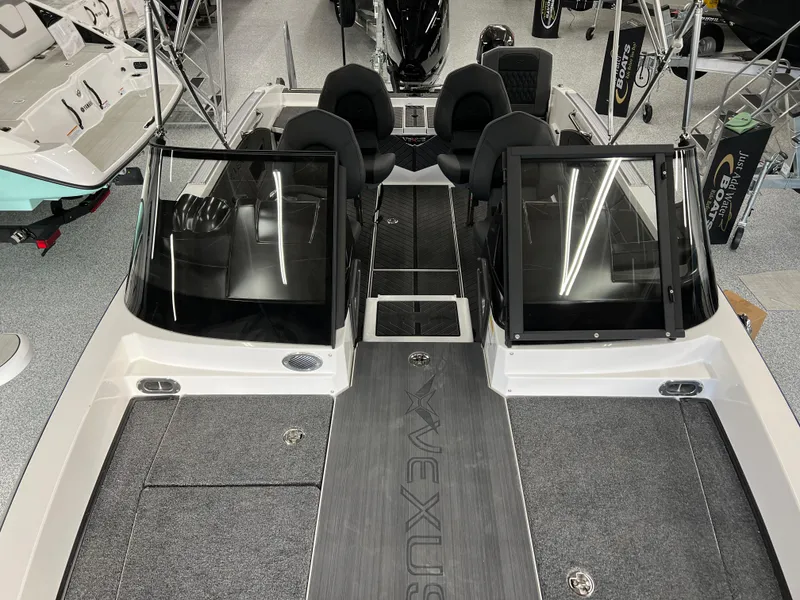 Slide: The Image of 2024 Vexus DVX 20S boat interior with dual consoles and seating. - 34