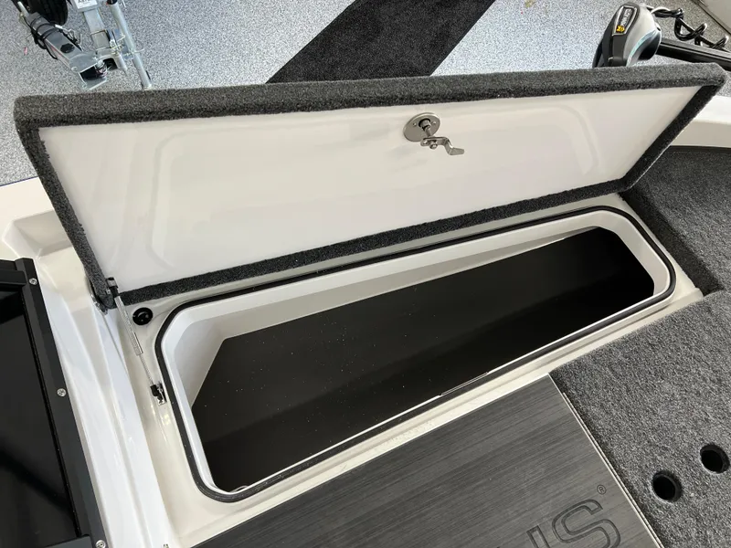 Slide: The Image of Open storage compartment on a 2024 Vexus DVX 20S boat. - 35