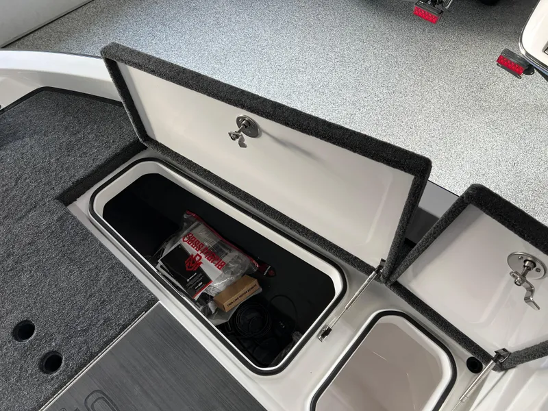 Slide: The Image of 2024 Vexus DVX 20S boat storage compartments with open lids. - 36