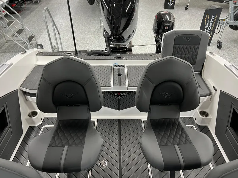 Slide: The Image of 2024 Vexus DVX 20S boat interior with black seats and modern design. - 39