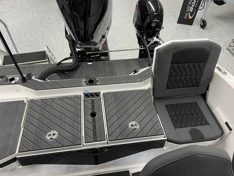 Slide: The Image of 2024 Vexus DVX 20S boat interior with black seating and storage compartments. - 40