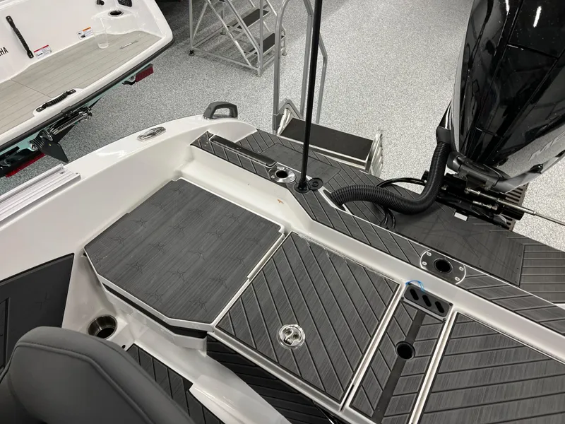 Slide: The Image of 2024 Vexus DVX 20S boat deck with sleek black and gray design. - 41