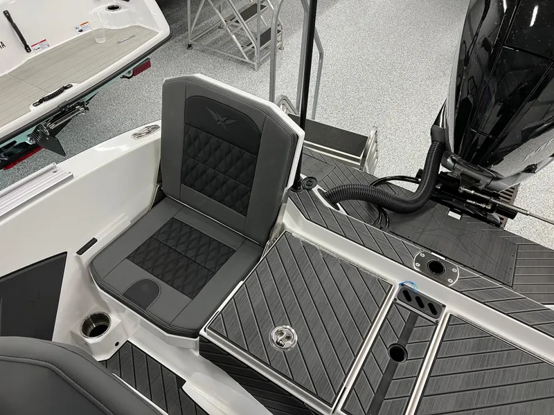 Slide: The Image of 2024 Vexus DVX 20S boat interior with black seating and storage compartments. - 42