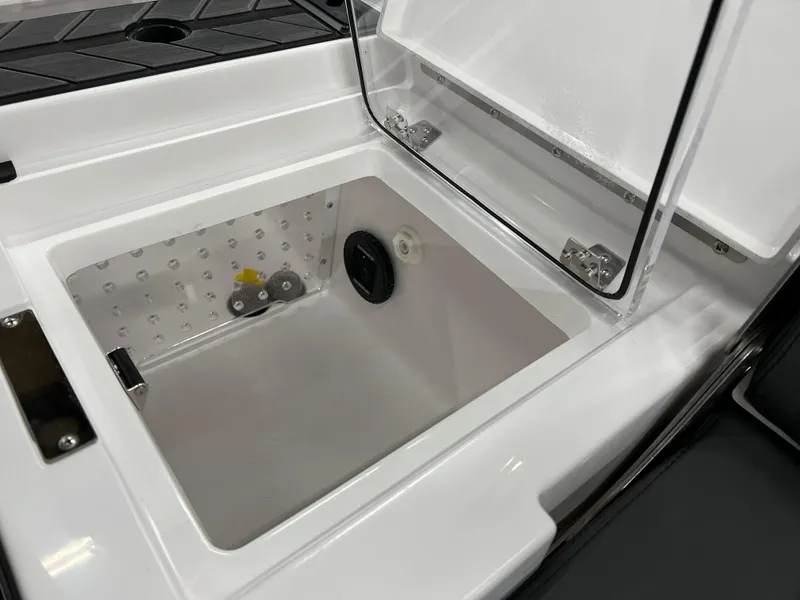 Slide: The Image of 2024 Vexus DVX 20S boat storage compartment with open lid. - 44