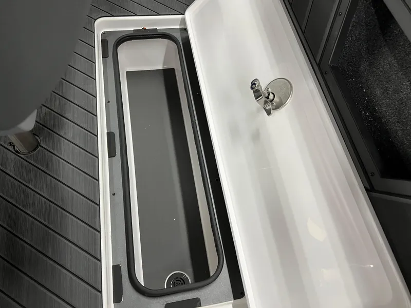 Slide: The Image of 2024 Vexus DVX 20S boat storage compartment with open lid. - 47