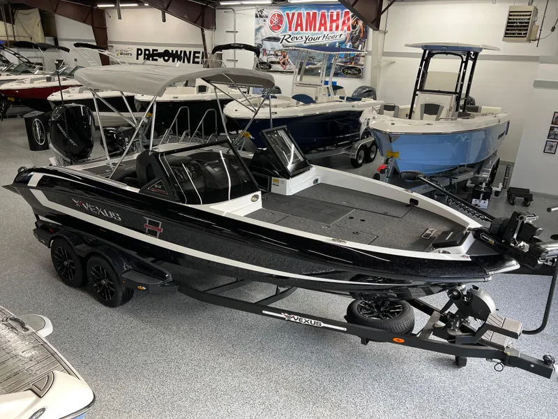 Slide: The Image of 2024 Vexus DVX 20S boat on trailer in showroom. - 6