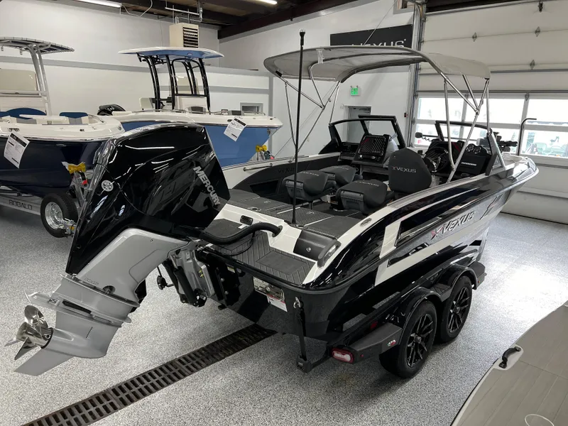 Slide: The Image of 2024 Vexus DVX 20S boat in showroom, rear view with outboard motor. - 7