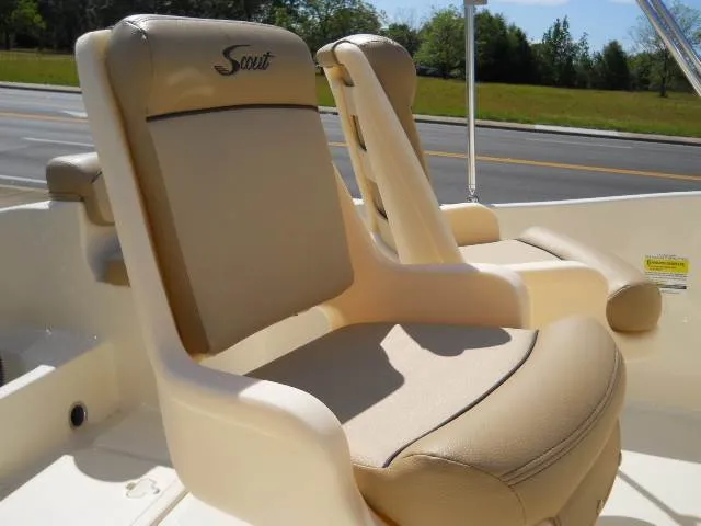 Slide: The Image of 2024 Scout 175 Sportfish boat seats, beige and tan, close-up view. - 2