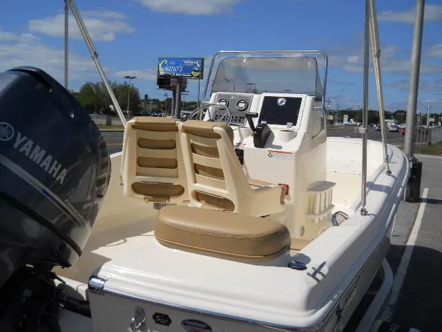 Slide: The Image of 2024 Scout 175 Sportfish boat with Yamaha engine, beige seats, and control console. - 5
