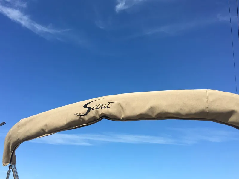 Slide: The Image of 2024 Scout 175 Sportfish boat canopy against a clear blue sky. - 9