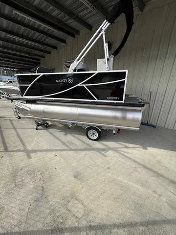 Slide: The Image of 2024 Godfrey Pontoons Mighty G 1476 F pontoon boat in storage facility. - 1