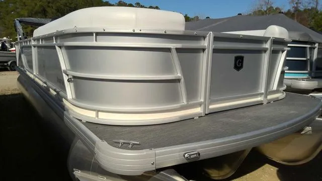 Slide: The Image of 2024 Sweetwater SW 2286 SFL pontoon boat, silver exterior, docked on a sunny day. - 1