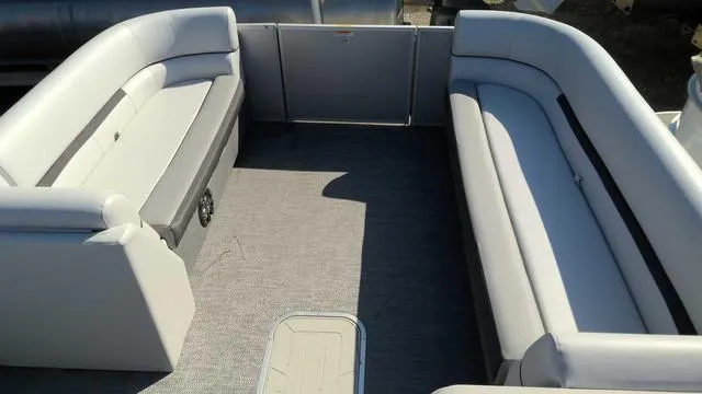 Slide: The Image of 2024 Sweetwater SW 2286 SFL pontoon boat interior with spacious seating. - 10