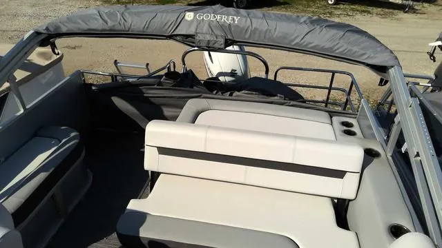 Slide: The Image of 2024 Sweetwater SW 2286 SFL pontoon boat interior with seating and canopy. - 4
