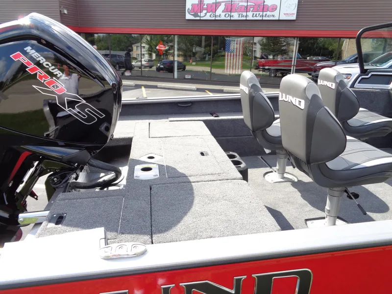 Slide: The Image of 2024 Lund 1875 Impact XS boat interior with Mercury Pro XS engine. - 23