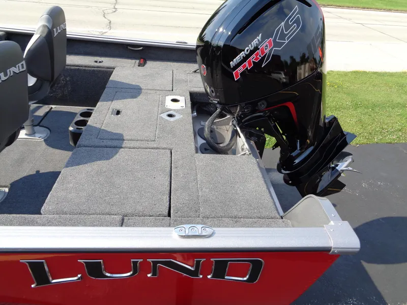 Slide: The Image of 2024 Lund 1875 Impact XS boat with Mercury Pro XS engine, red exterior. - 7