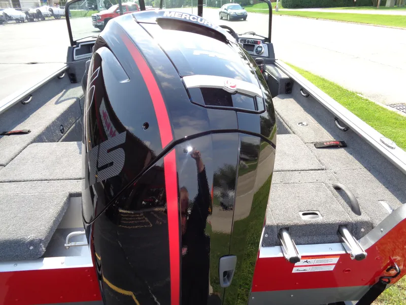 Slide: The Image of 2024 Lund 1875 Impact XS boat with Mercury outboard engine, rear view. - 9