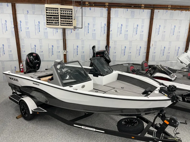 Slide: The Image of 2024 Vexus ADX180 boat in a garage, on a trailer. - 0