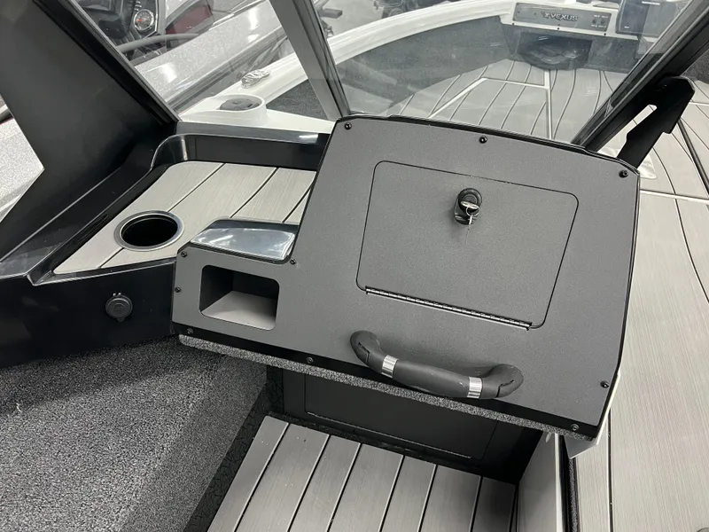 Slide: The Image of 2024 Vexus ADX180 boat console with storage compartment and cup holder. - 10