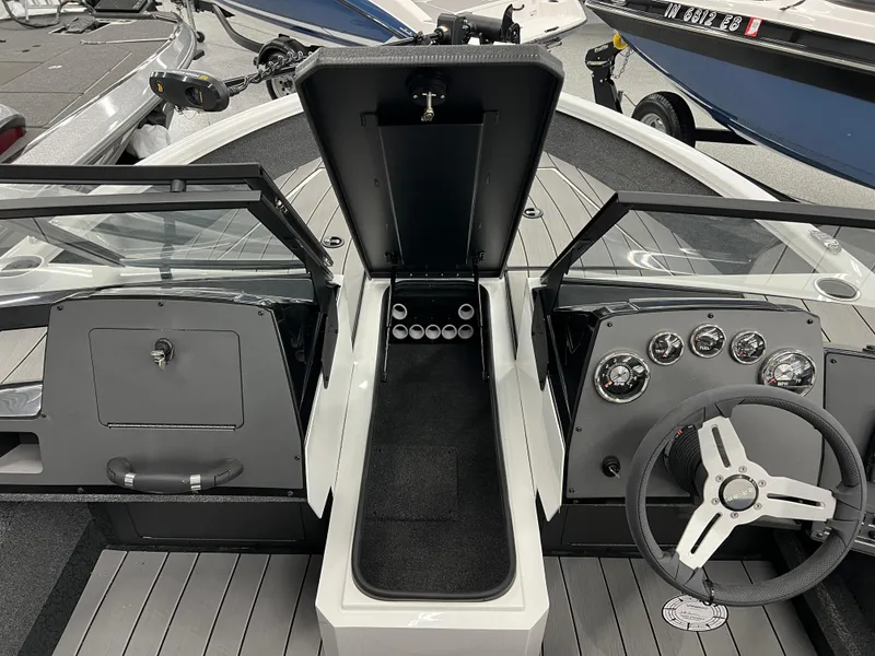 Slide: The Image of 2024 Vexus ADX180 boat interior with open storage compartment and steering console. - 14
