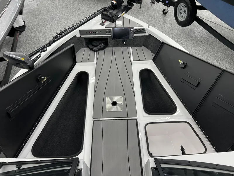 Slide: The Image of 2024 Vexus ADX180 boat interior with storage compartments and fishing equipment. - 17
