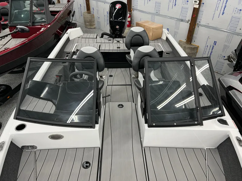 Slide: The Image of 2024 Vexus ADX180 boat interior with dual consoles and seating. - 18