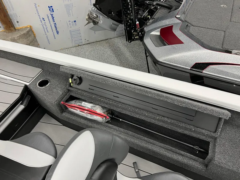 Slide: The Image of 2024 Vexus ADX180 boat interior storage compartment with paddle and seating. - 20