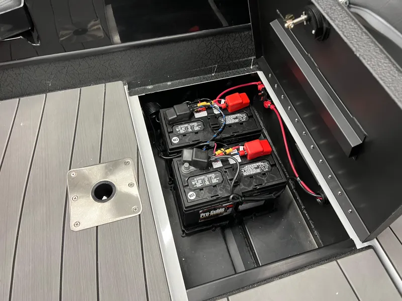 Slide: The Image of 2024 Vexus ADX180 boat battery compartment with dual batteries. - 24