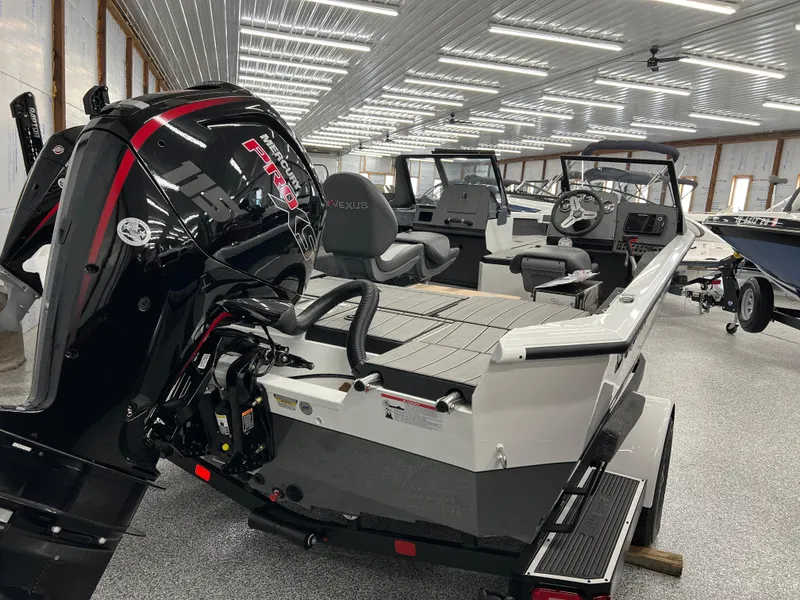 Slide: The Image of 2024 Vexus ADX180 boat with powerful outboard motor in showroom. - 3