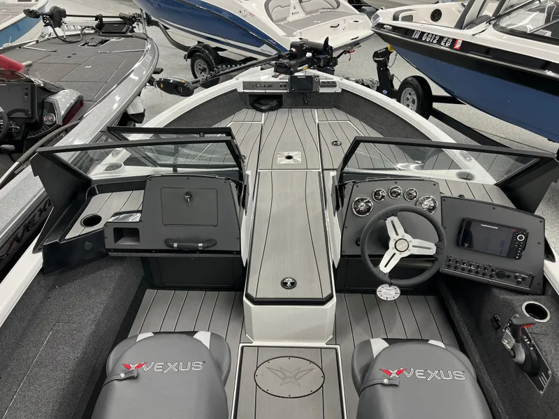 Slide: The Image of 2024 Vexus ADX180 boat interior with dual consoles and advanced navigation system. - 6