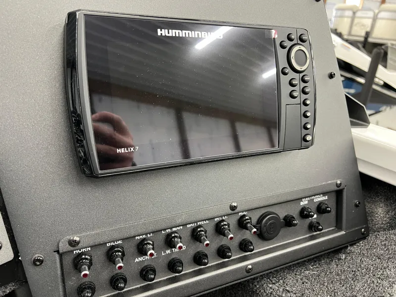 Slide: The Image of 2024 Vexus ADX180 boat dashboard with Humminbird Helix 7 fish finder and control panel. - 9