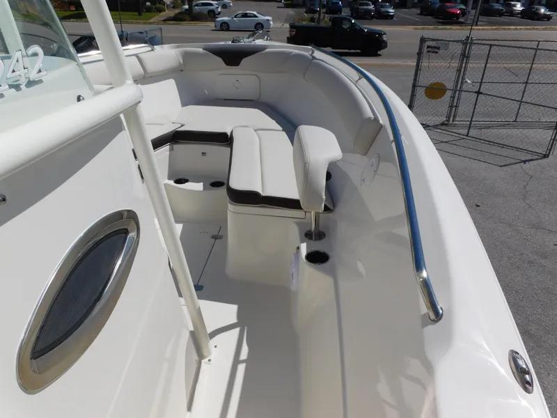 Slide: The Image of 2024 Sailfish 242 CC boat interior with seating and railing. - 15