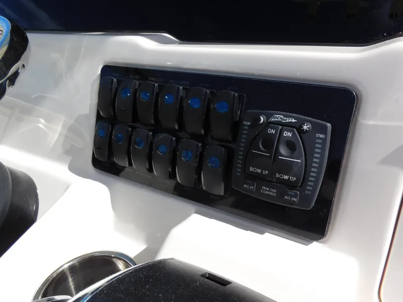 Slide: The Image of Control panel of 2024 Sailfish 242 CC boat with switches and joystick. - 19