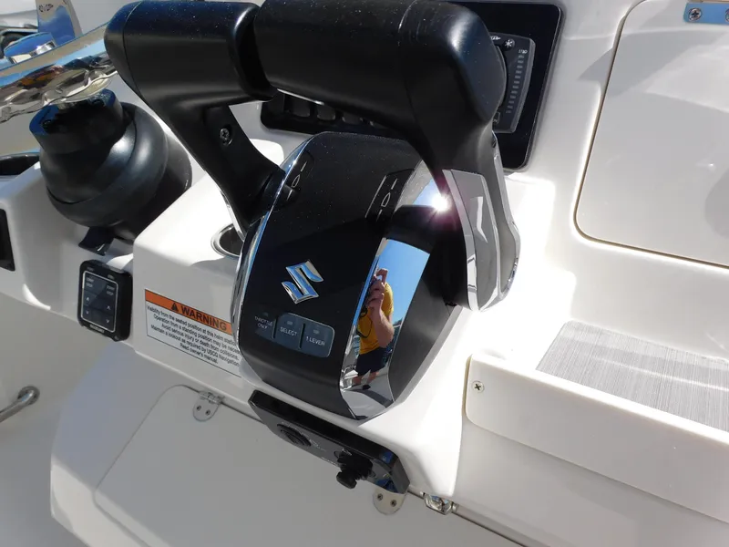 Slide: The Image of Close-up of the control panel on a 2024 Sailfish 242 CC boat. - 20