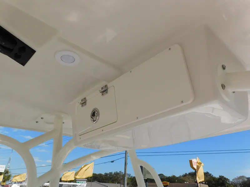 Slide: The Image of 2024 Sailfish 242 CC boat overhead storage compartment. - 23