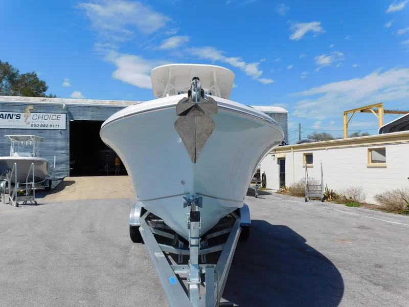 Slide: The Image of 2024 Sailfish 242 CC boat on trailer outside a storage facility. - 3