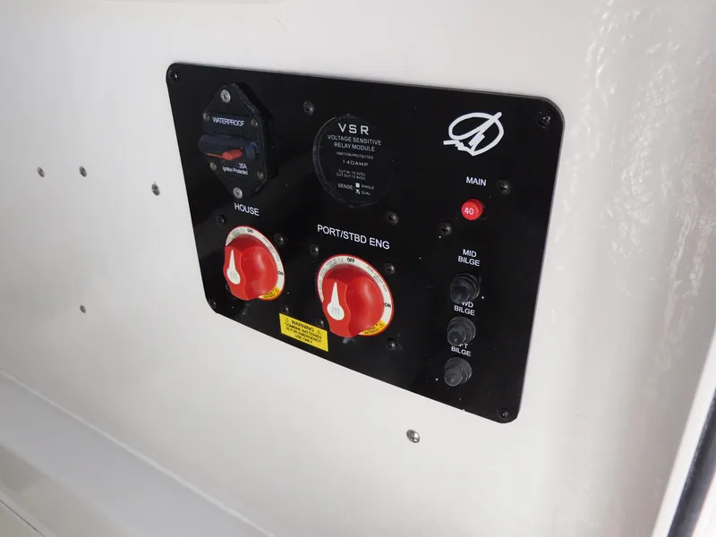 Slide: The Image of Control panel of a 2024 Sailfish 242 CC boat with battery switches. - 41