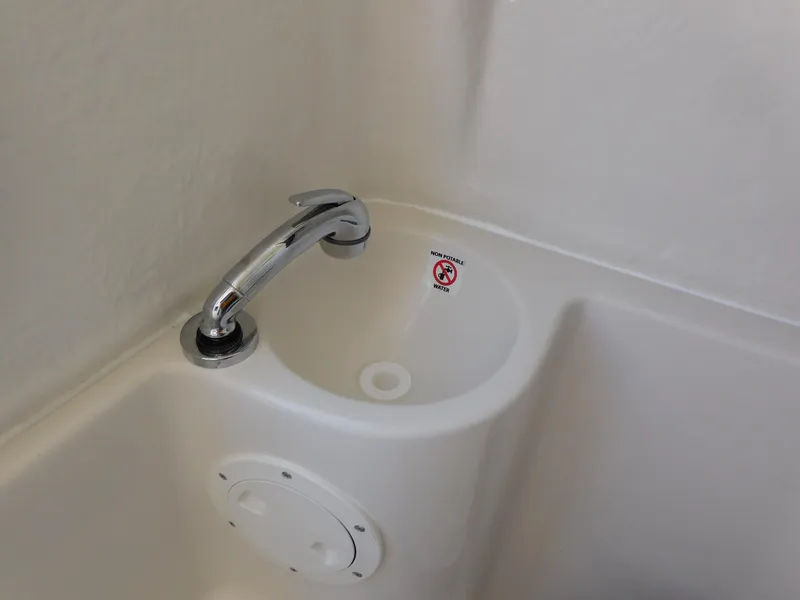 Slide: The Image of 2024 Sailfish 242 CC boat sink with chrome faucet. - 43