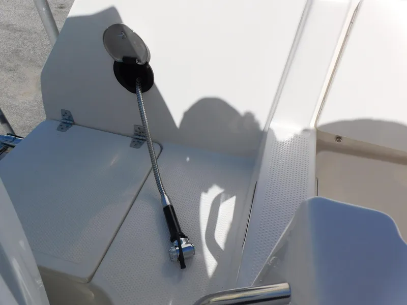 Slide: The Image of 2024 Sailfish 242 CC boat deck with fuel hose and compartment. - 44