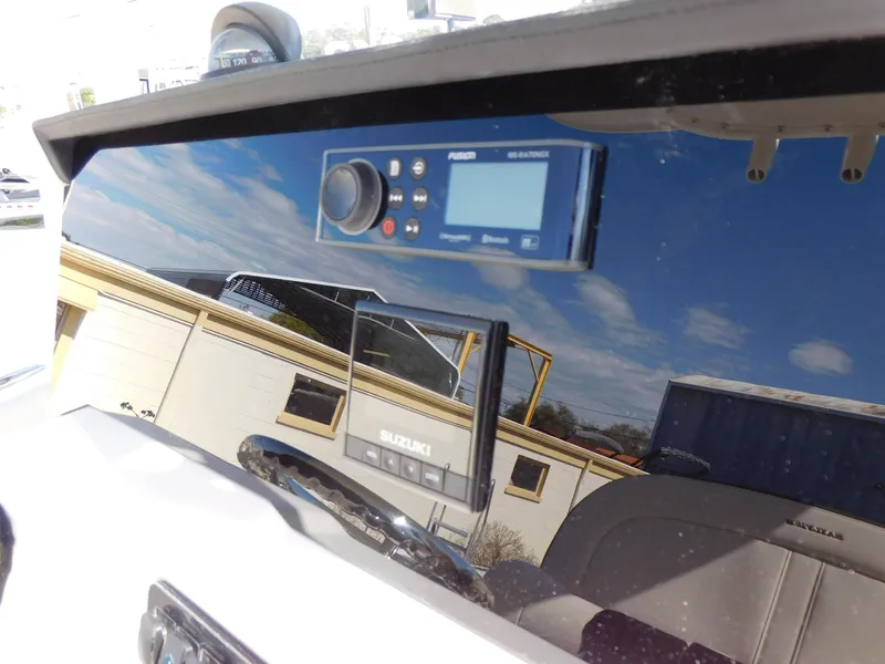 Slide: The Image of 2024 Sailfish 242 CC boat dashboard with Suzuki control panel. - 47