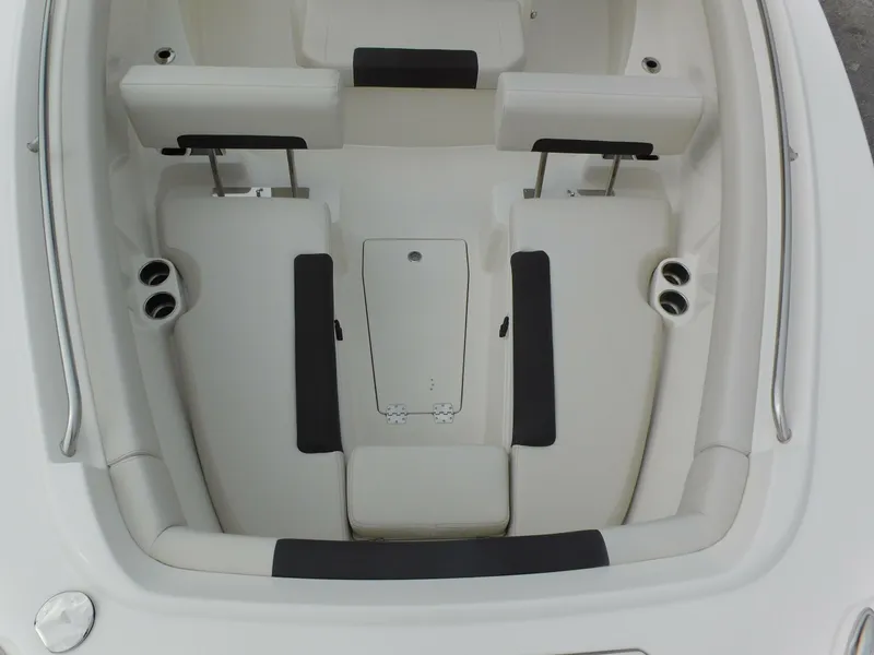 Slide: The Image of 2024 Sailfish 312 CC boat interior seating and storage compartments. - 10