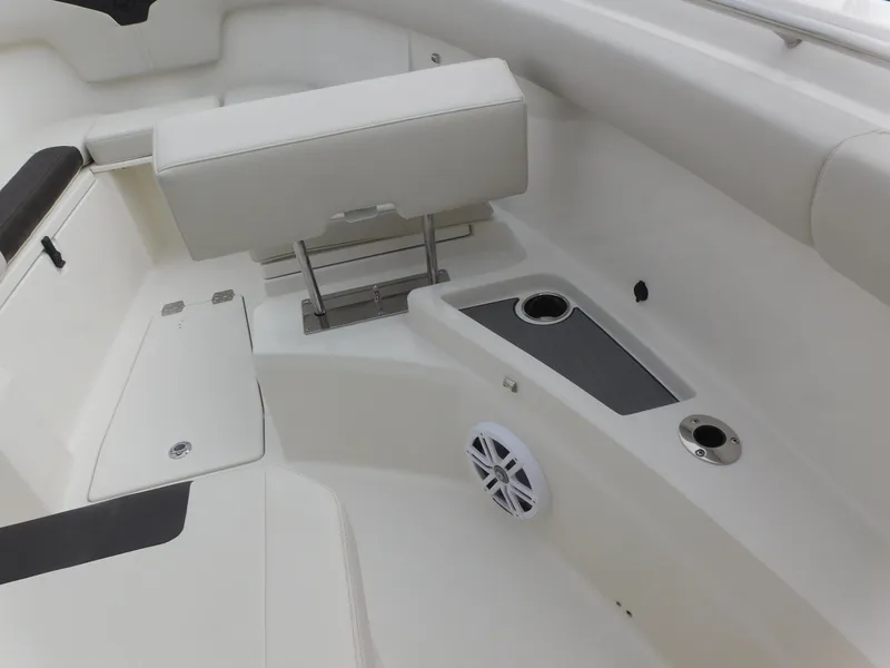 Slide: The Image of 2024 Sailfish 312 CC boat interior with seating and storage compartments. - 15
