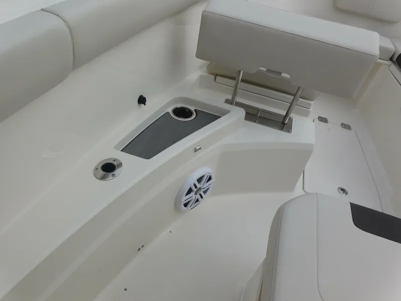 Slide: The Image of 2024 Sailfish 312 CC boat interior seating and storage area. - 16